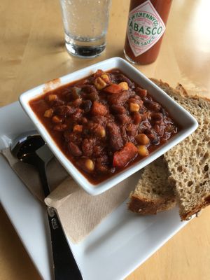 Cup of Vegan Black Bean Chili. Goes great with the Vegan Street Tacos. Beware - the 2 sides offered with the chili are NOT vegan (ciabatta bread & crackers) so I requested wheat bread which they said was vegan. at Peoples Organic in Eden Prairie