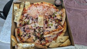 A cheese, a veggie, and cheese sticks. Way too good to take a pic while fresh, this is the next day leftovers. lol at Pizzoco in Winchester