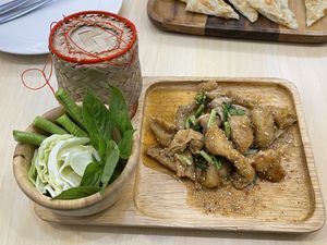 Spicy grilled veganpork and sticky rice, 99 baht (plus 7% tax)  at Bai Plu House in Bangkok