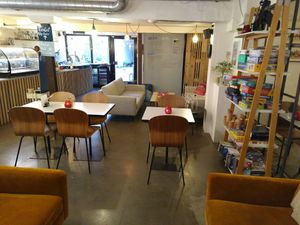 Room and shelf with board games at Cafe Lima in Aarhus