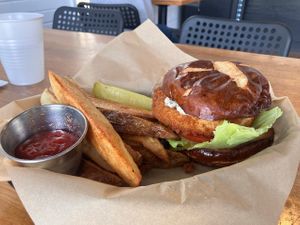 Uncluckables Chick'n Sandwich with a side of Buffalo sauce  at Trio in Cape Girardeau