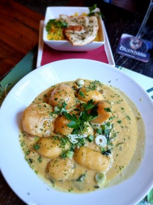 Curry dish with potatoes,chickpeas and rice and naan bread at Delaney's in Bruges