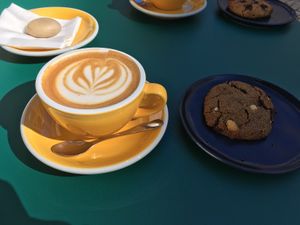 Coffee with oat milk and vegan cookie at Milkees in Lisbon