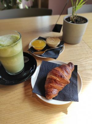 croissant with matcha latte at RoseHip Bistro - Pylimo in Vilnius