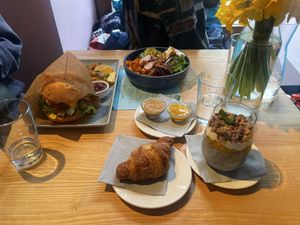 Sunday’s brunch: Juicy lentil burger with beetroot sauce, buckwheat bowl with pumpkin and feta, chia pudding and croissant with PB&Jam  at RoseHip Bistro - Pylimo in Vilnius