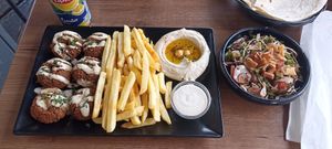 Falafel plate with fries, houmous, sesam sauce, salad, and bread at Lebanese Corner in Lisbon