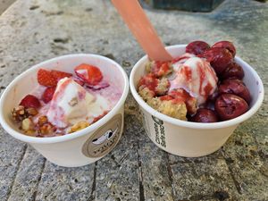 Left: "Mr. Tom" & strawberries; right: "Omas Streusel" & cherries; both with strawberry sauce at YOMARO - Domstrasse in Wurzburg