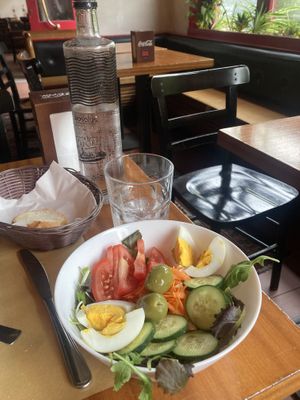 Water (carbonated or still), bread, and salad with lunch menu  at Al Vapore  in Venice
