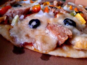 Pizza Smoking Sausage at Filthy Vegan in Ho Chi Minh City