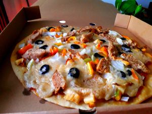 Pizza Smoking Sausage at Filthy Vegan in Ho Chi Minh City