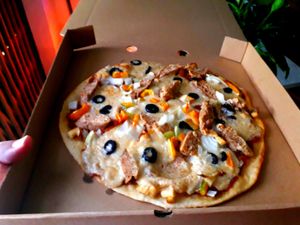 Pizza Smoking Sausage at Filthy Vegan in Ho Chi Minh City