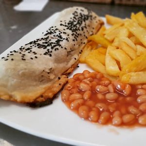 Vegan sausage roll with chips and beans at Filthy Vegan in Ho Chi Minh City