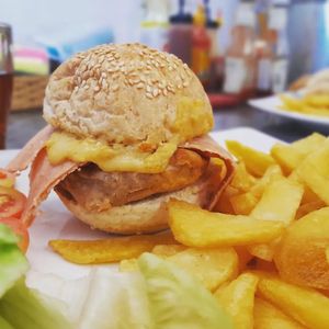 Vegan bacon cheese burger with fries at Filthy Vegan in Ho Chi Minh City