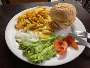 Bacon and cheese burger with salad and chips   at Filthy Vegan in Ho Chi Minh City