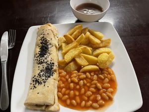 Sausage roll with chips, beans and gravy, 230,000 VND  at Filthy Vegan in Ho Chi Minh City