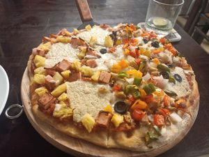 Half-and-halfed pizza, with cashew cheese at Filthy Vegan in Ho Chi Minh City