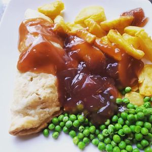 Cashew cheese and onion pasty with chips, peas and vegan gravy 230,000 at Filthy Vegan in Ho Chi Minh City