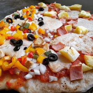 Half Half Pizza. Half Pizza Mexican and half Pizza Hawaii at Filthy Vegan in Ho Chi Minh City