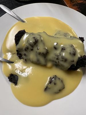 Chocolate cake and custard   at Filthy Vegan in Ho Chi Minh City