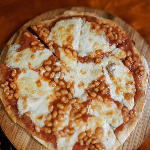 Cashew cheese and baked beans pizza! 199.000 at Filthy Vegan in Ho Chi Minh City