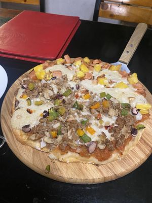 Pizza half Mexican half Hawaiian   at Filthy Vegan in Ho Chi Minh City