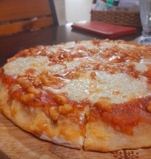 Cashew cheese and baked beans pizza at Filthy Vegan in Ho Chi Minh City