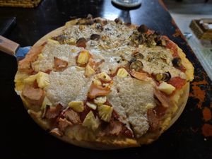 Pizza, half Hawaiian, half mushroom and garlic at Filthy Vegan in Ho Chi Minh City