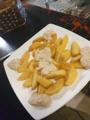 Cheesy chips 7.5/10 - soft inside almost like potato wedges with the size and thickness at Filthy Vegan in Ho Chi Minh City