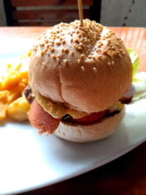 Vegan spicy bean burger with facon bacon and homemade chips at Filthy Vegan in Ho Chi Minh City