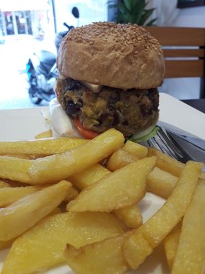 A filthy spicy bean burger with home cooked fries and vegan cheese at Filthy Vegan in Ho Chi Minh City