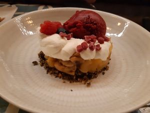 Dessert: Baked apple and banana with blackcurrant ice-cream on crunchy caramelized chia seeds at VEGA - Alamo in Madrid