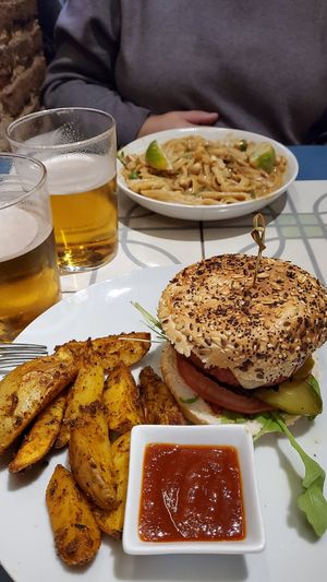 The traditional burger and the pad thai noodles at VEGA - Alamo in Madrid