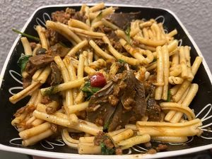 Bolognese with basil and shredded parm, mushrooms (PLATED) at VEGA - Alamo in Madrid