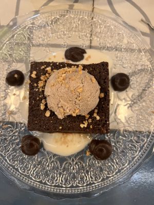 Warm Chocolate Brownie: with peanut ice cream, praliné and Catalan cream   at VEGA - Alamo in Madrid