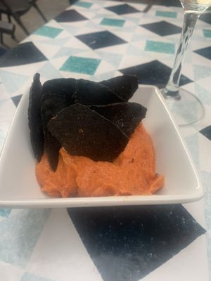 Charcoal tortilla with carrot hummus   at VEGA - Alamo in Madrid