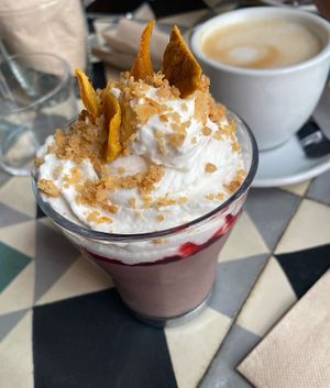 Pannacotta and oat milk decaf coffeee  at VEGA - Alamo in Madrid