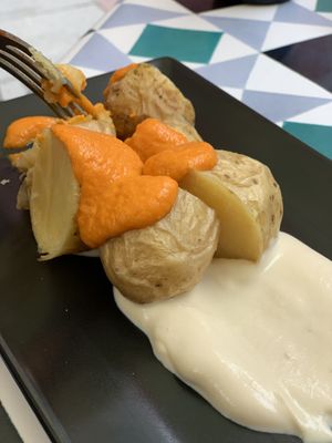 Canarian potatoes with red mojo at VEGA - Alamo in Madrid