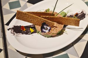 beyond meat steak tartar with old style mustard, pickles and sesame seeds toast at VEGA - Alamo in Madrid