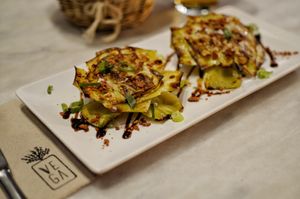 Grilled Artichokes with balsamic vinegar, crunchy "bacon" and chinesse scallion at VEGA - Alamo in Madrid
