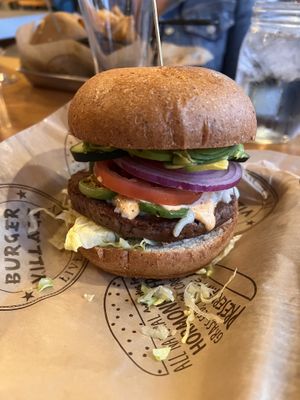 Impossible patty with the beanstalk add cucumbers and vegan bun  at Burger Village in San Luis Obispo