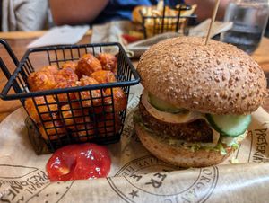 Village veggie burger with slippery puffball toppings, side of sweet potato tots at Burger Village in San Luis Obispo