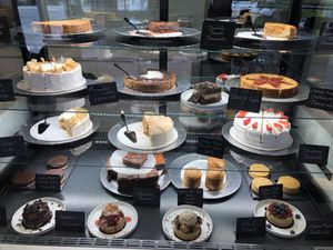 case full of amazing cakes and other desserts 😍 at How Delish HD in West Orange