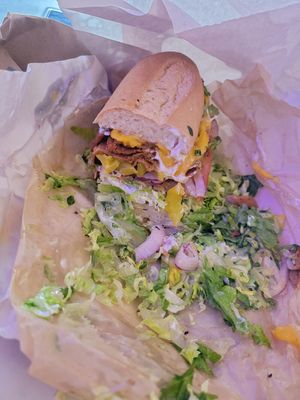 Pastrami with hot peppers, cheddar cheese on a gluten free bun at How Delish HD in West Orange