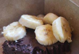 Chocolate cheesecake (or what's left) with bananas at How Delish HD in West Orange