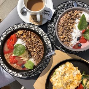 Porridge with rice milk and a smoothie bowl. at Na Golfu in Celje