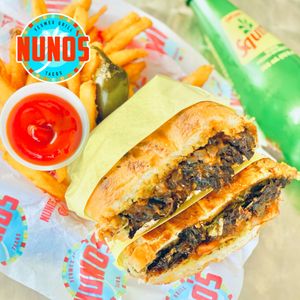 Hibiscus flowers Birria barbacoa torta  at Nuno's Tacos & Vegmex Grill in Dallas