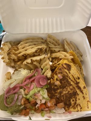 Al pastor quesadilla with waffle fries  at Nuno's Tacos & Vegmex Grill in Dallas