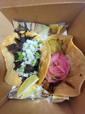 Seasonal barbacoa tacos were amazing! The BBQ taco on the right was fantastic too. at Nuno's Tacos & Vegmex Grill in Dallas