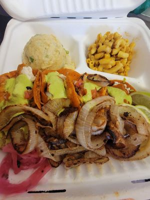 Street tacos with potato salad and Mac and cheese. You can't ask for better comfort food than that!!!!! SO good! at Nuno's Tacos & Vegmex Grill in Dallas