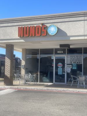 Storefront with ordering/pickup instructions   at Nuno's Tacos & Vegmex Grill in Dallas